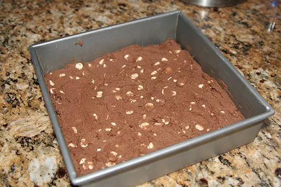 chocolate cookie dough in square baking pan