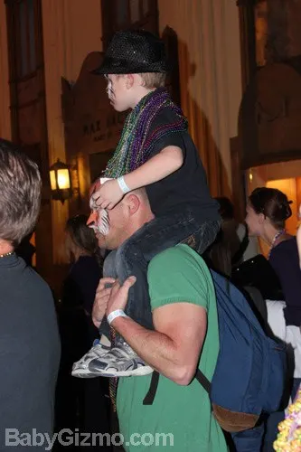 little boy on dad's shoulders
