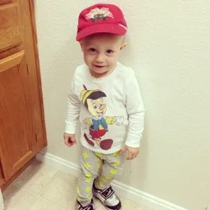 toddler with red hat