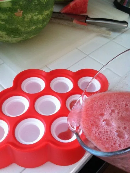 pouring watermelon juice in pop molds