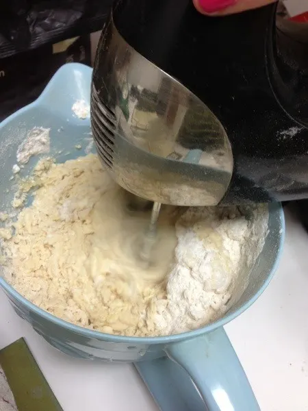 mixing dough with hand mixer