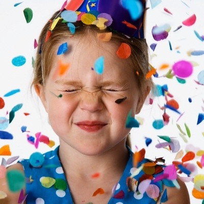 little girl with confetti