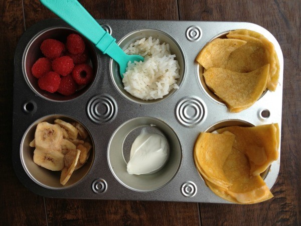 variety of food in a muffin tin