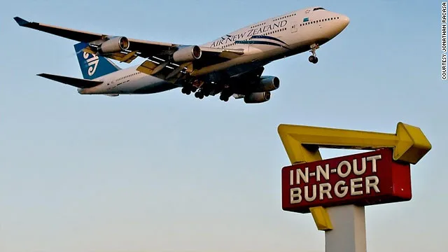 In-N-Out sign with plane above