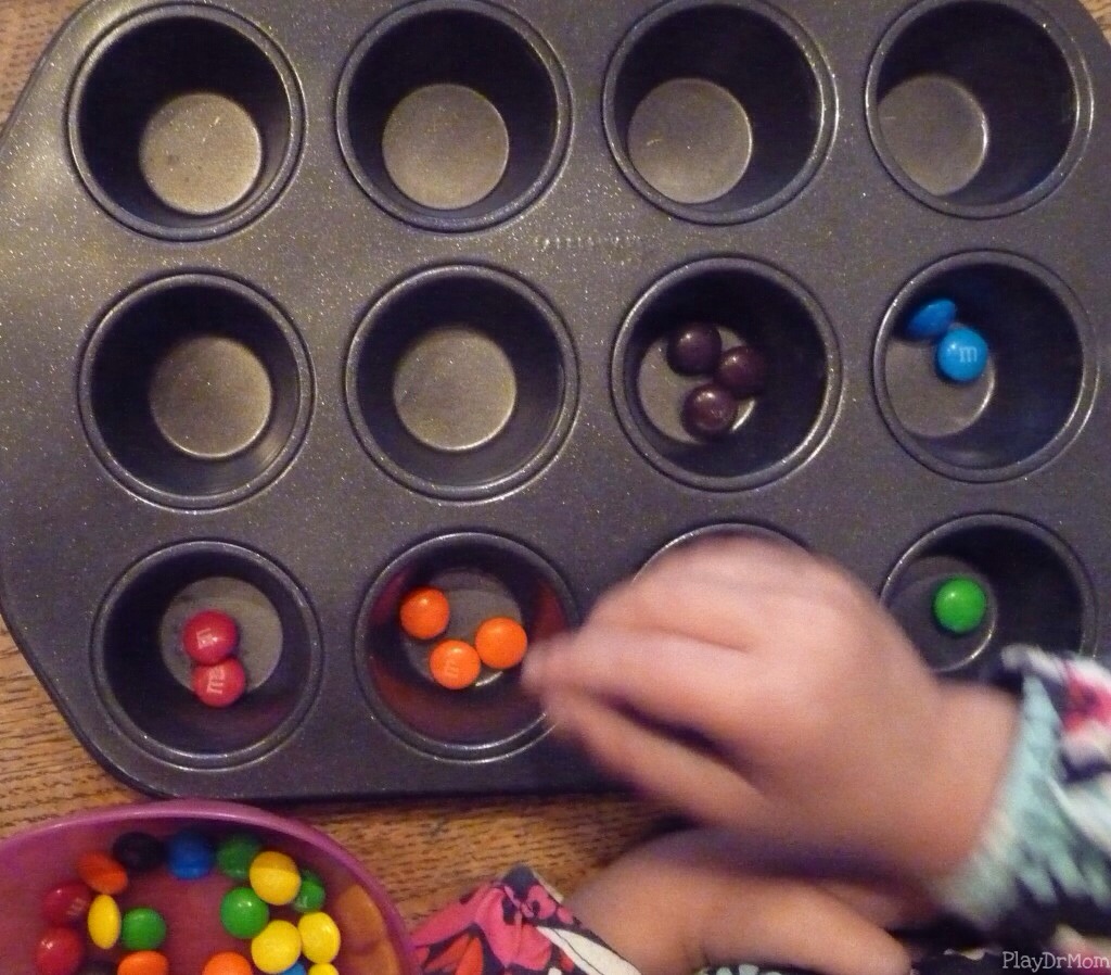 sorting with m&ms in a muffin tin
