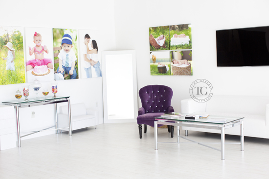 white office with canvases on wall