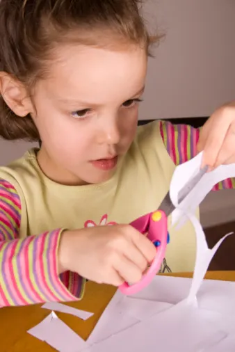Girl using scissors