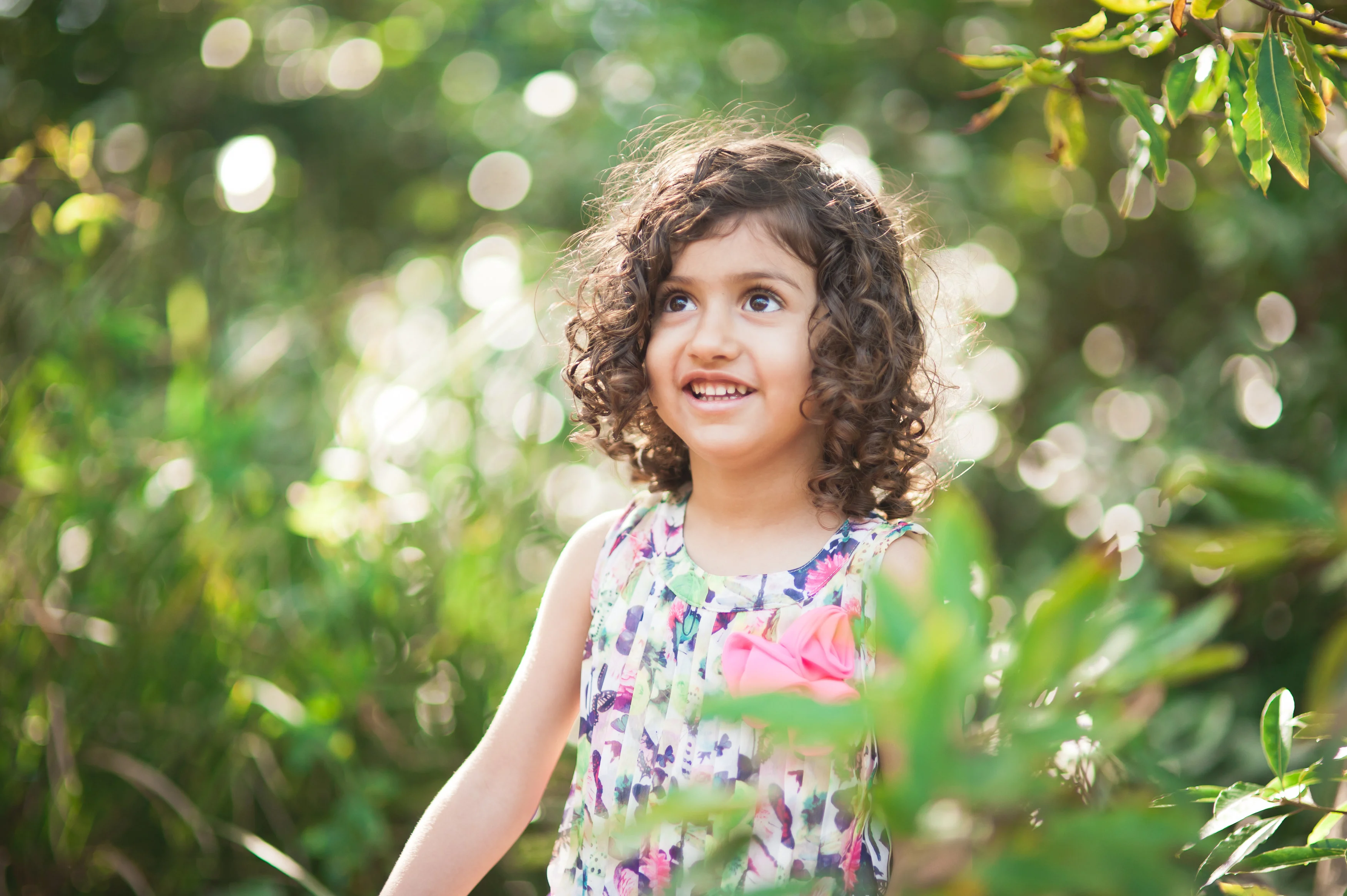 little girl with brown curly hair