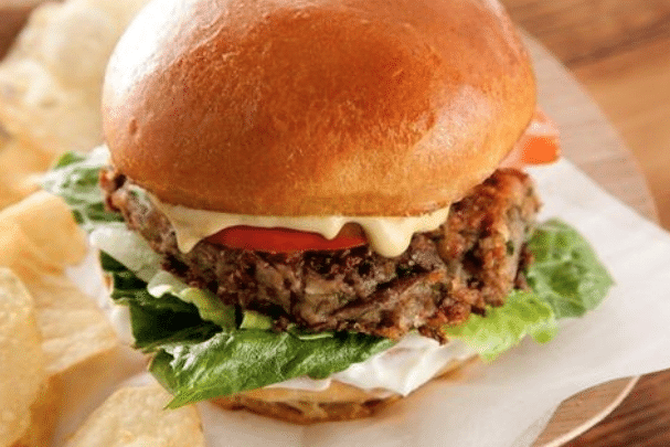 large hamburger with lettuce and cheese