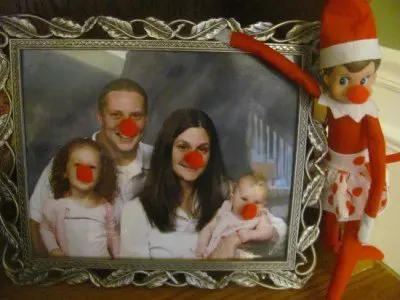 elf on the shelf puts red noses on family