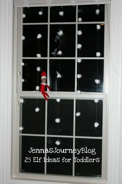 elf on the shelf puts snow on window