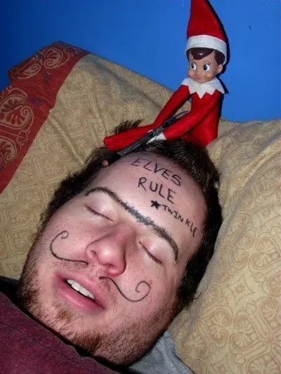 elf on shelf draws on dad's face