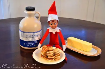 elf on the shelf with a plate of pancakes