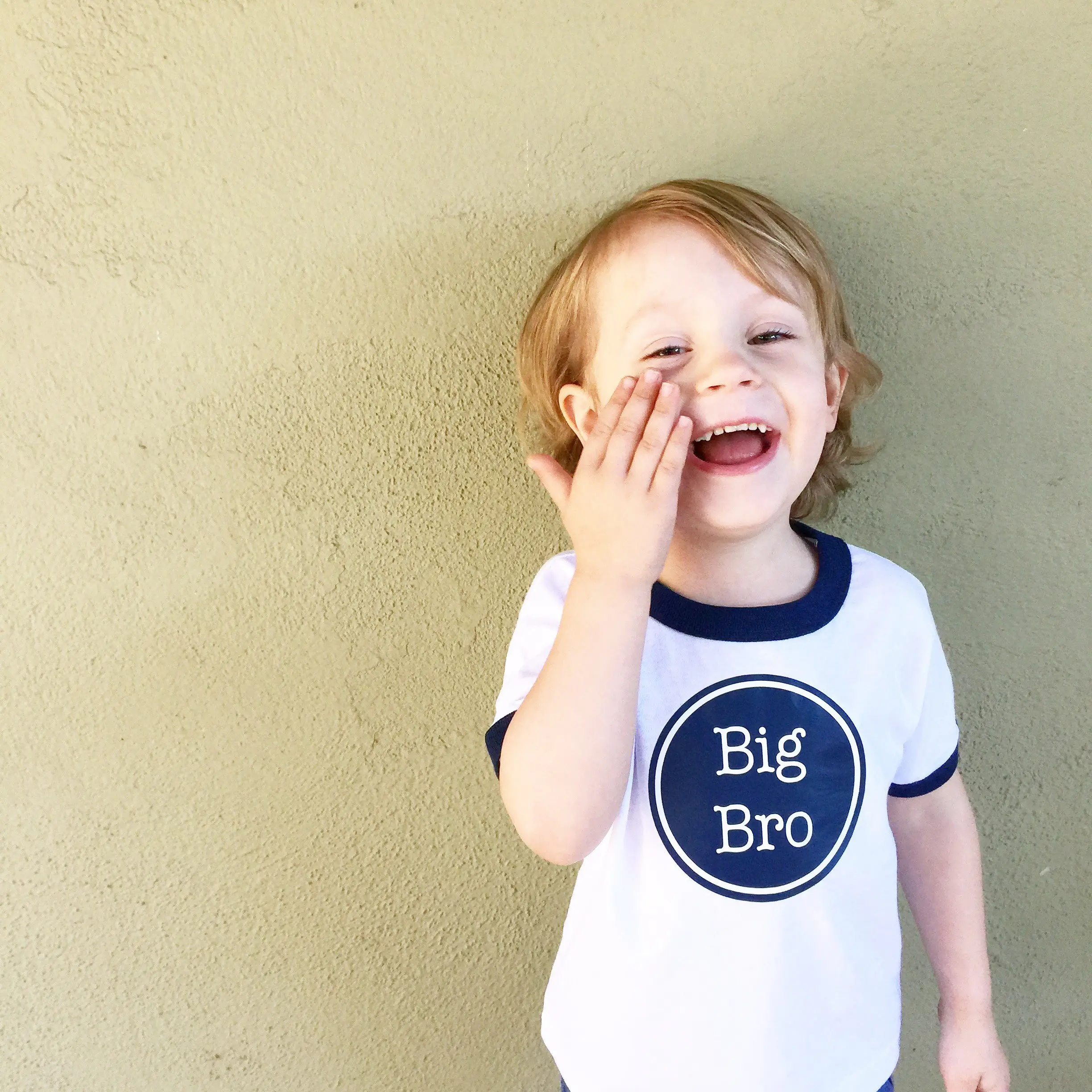 little boy with big bro shirt