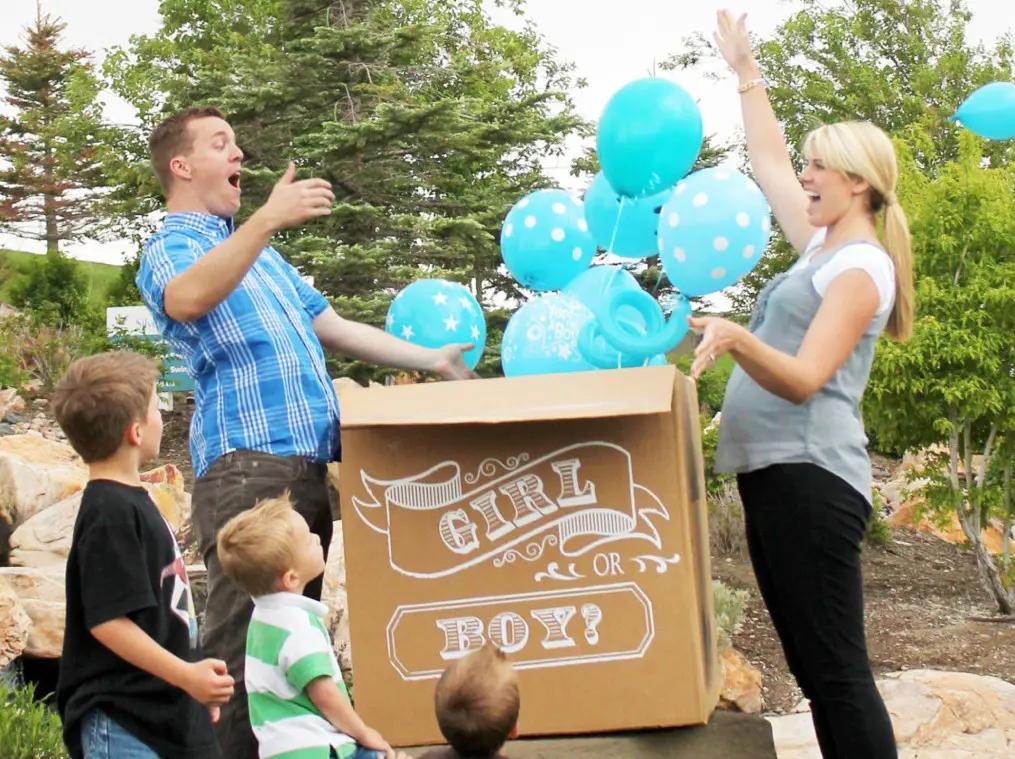 gender reveal with balloons