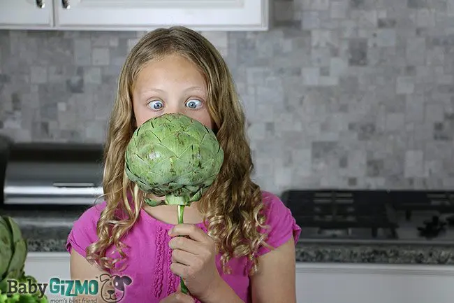 girl surprised with artichoke on a stick