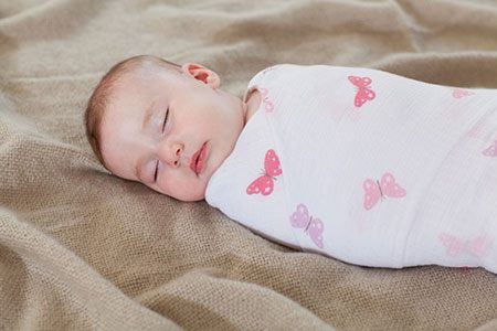 baby sleeping in a swaddle
