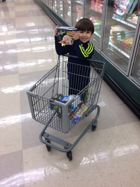boy with grocery cart