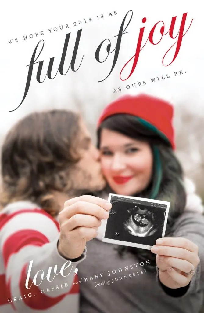 couple holding out an ultrasound photo