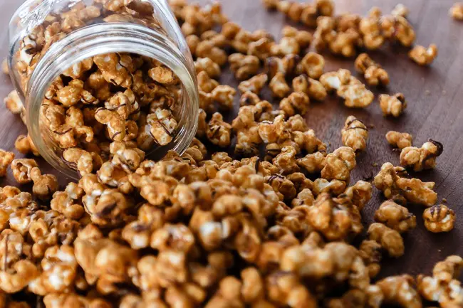 caramel corn spilled out of a jar