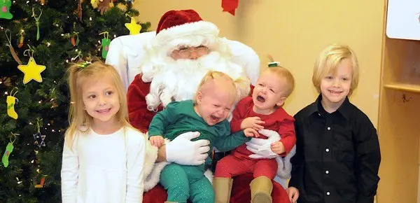 twins crying with santa