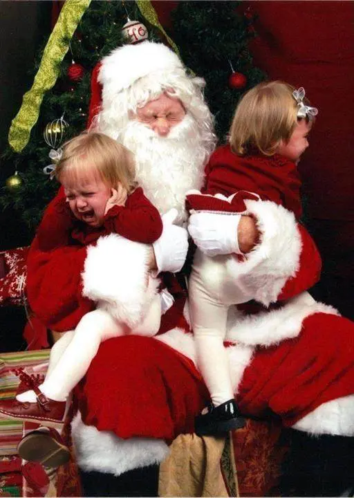 two kids screaming with santa