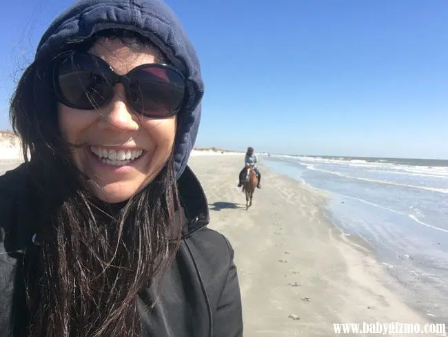 girl on beach horseback riding