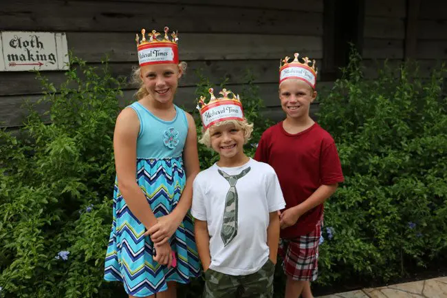 three kids outside medieval times