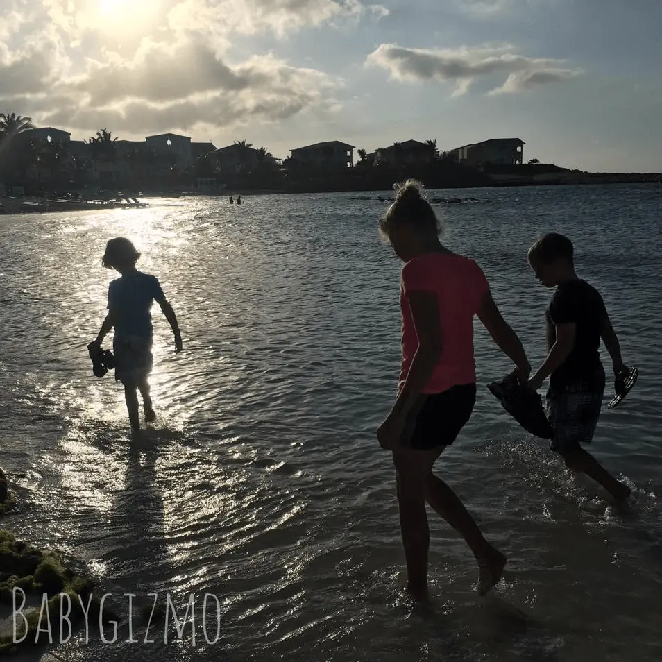 three kids on the beach in Jamaica