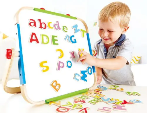 toddler with letters