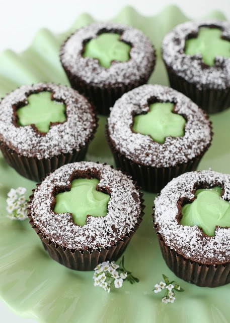chocolate cupcakes with green shamrock cut out