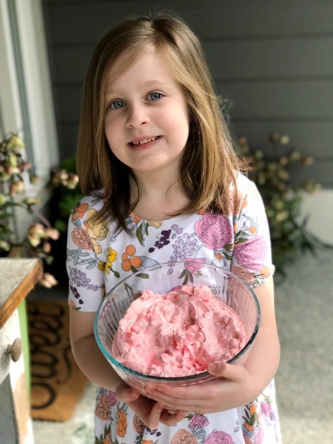 little girl holding jello treat