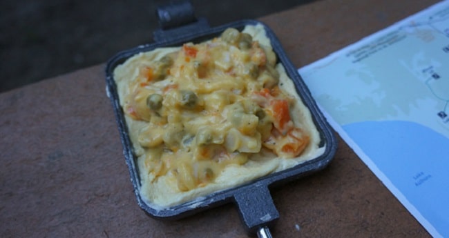 Chicken pot pie made in a pie iron.