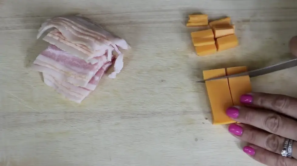 cutting cheese next to bacon