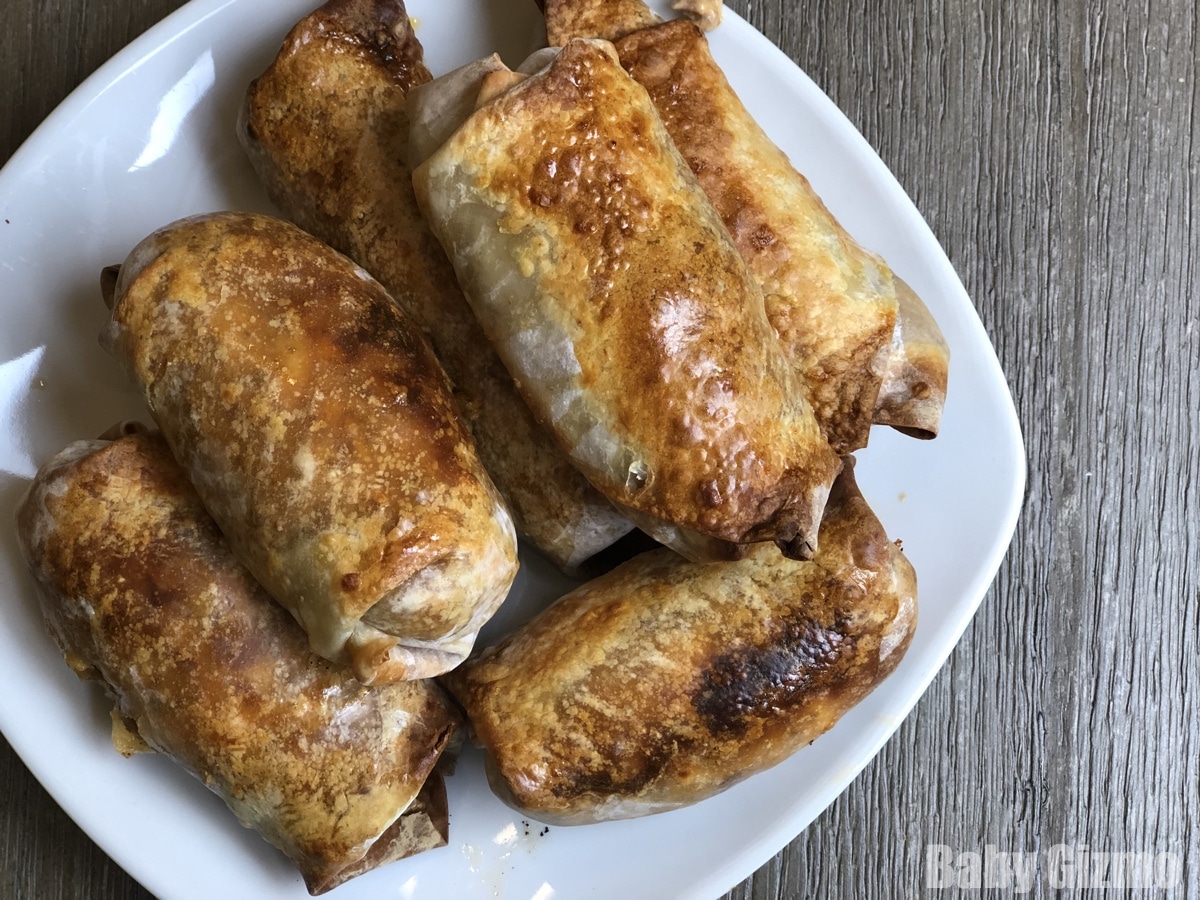 cheeseburger eggrolls on a white plate