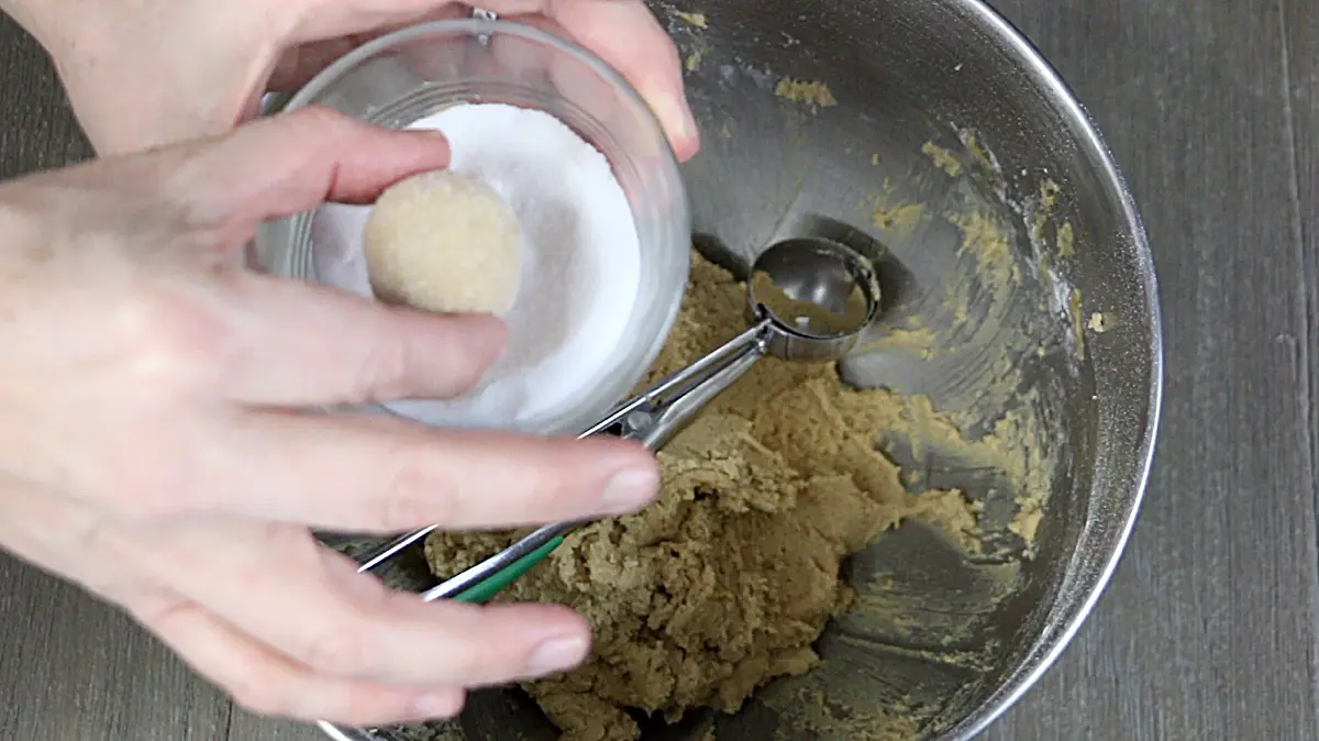 dipping cookie dough balls in sugar