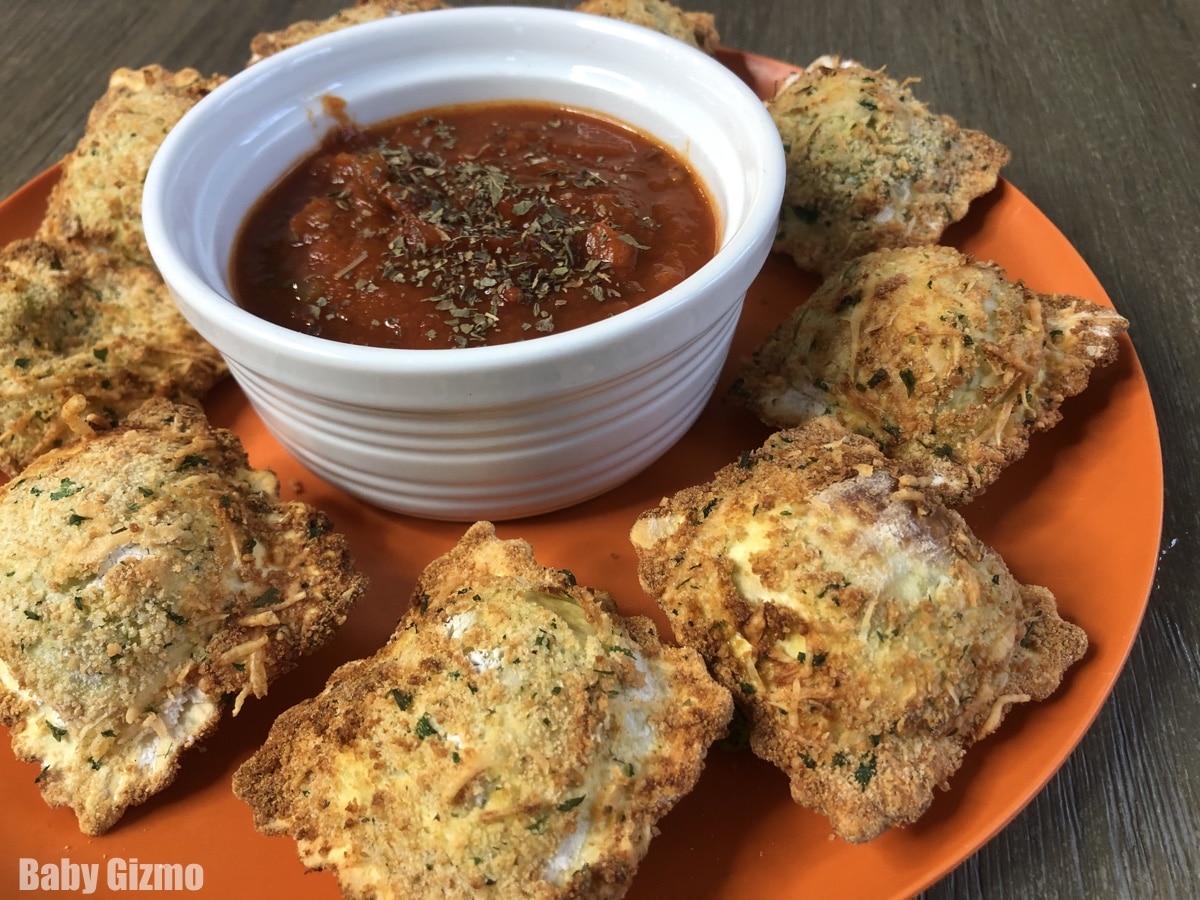 air fried toasted ravioli on orange plate