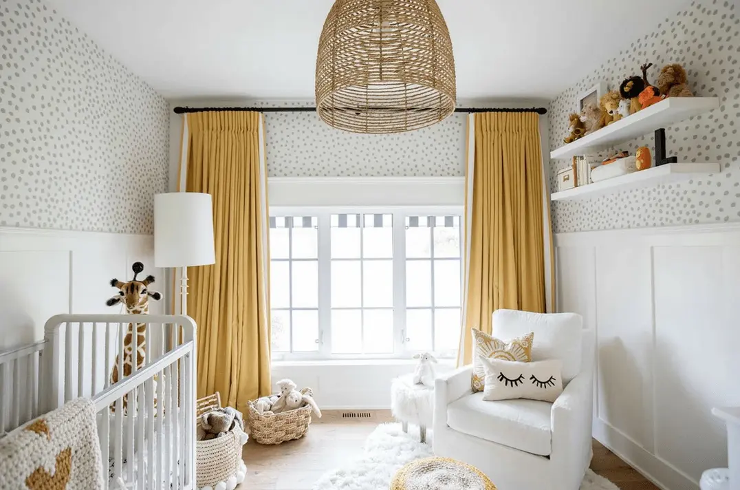 nursery with yellow curtains and white accents