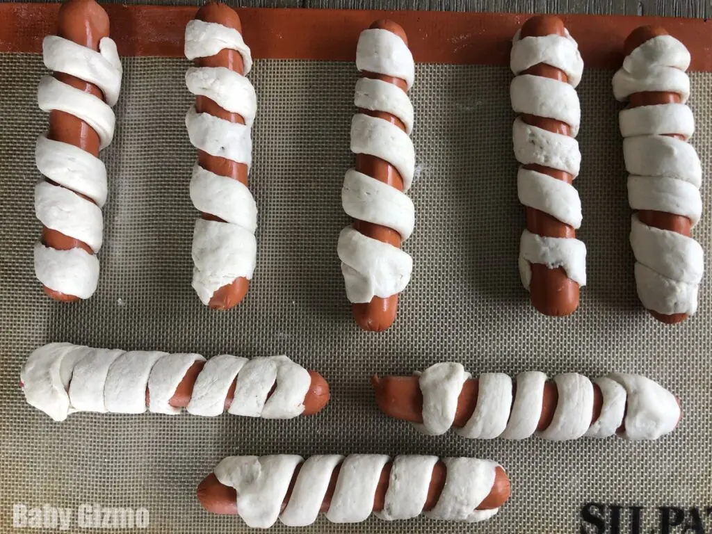 pretzel dogs on baking sheet