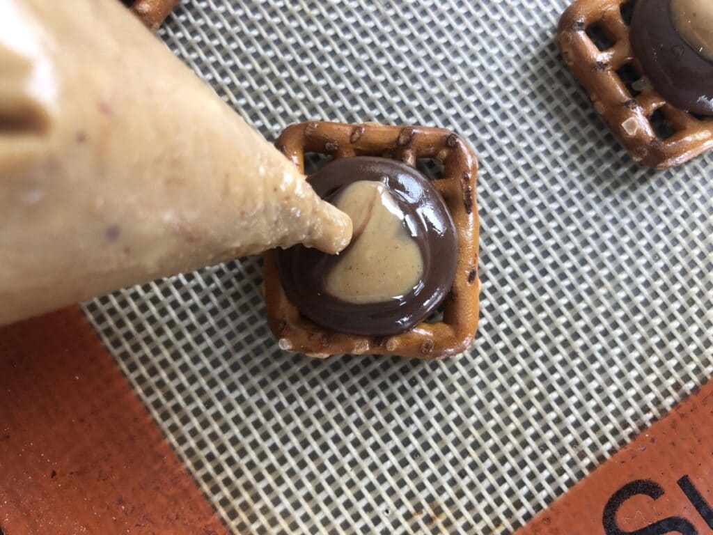 peanut butter and chocolate on a pretzel