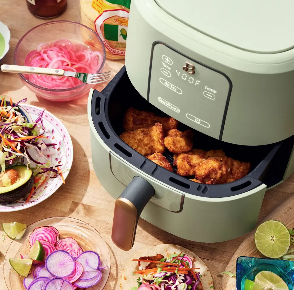 https://babygizmo.com/wp-content/uploads/2021/03/green-air-fryer-by-drew-barrymore.jpg.webp