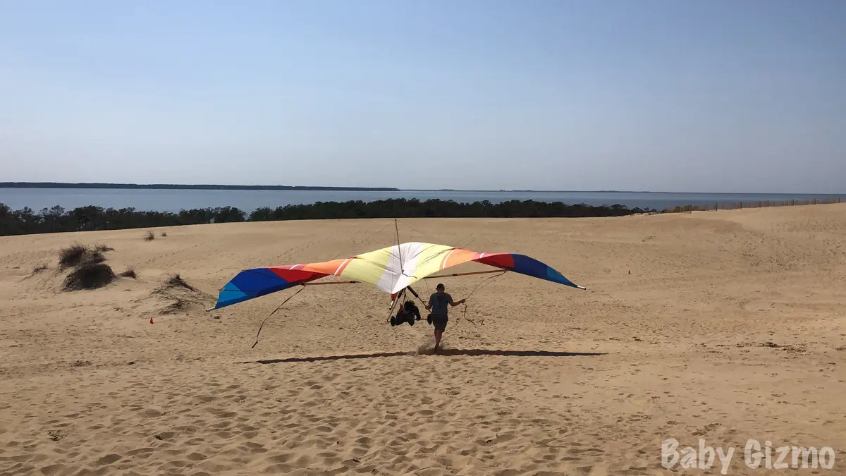 hang gliding over dunes