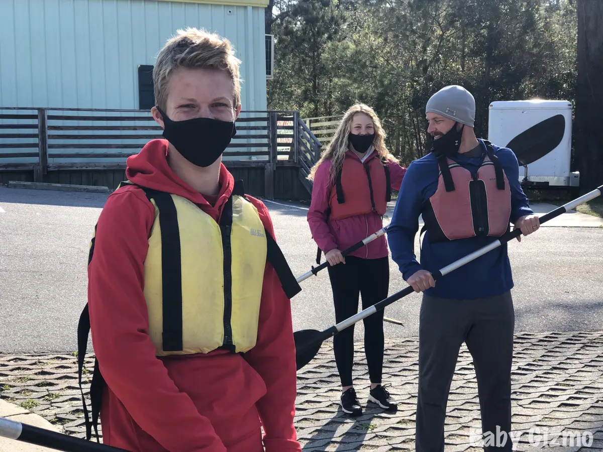 teens and dad kayaking