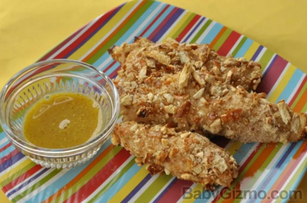 chickenfingers honey mustard pretzel chicken tenders on striped plate