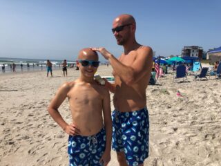 dad and boy with natural sunscreen