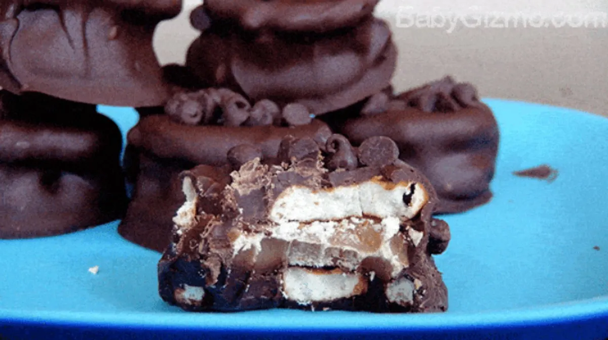 Chocolate Covered Caramel Pretzel Bites on a blue plate 