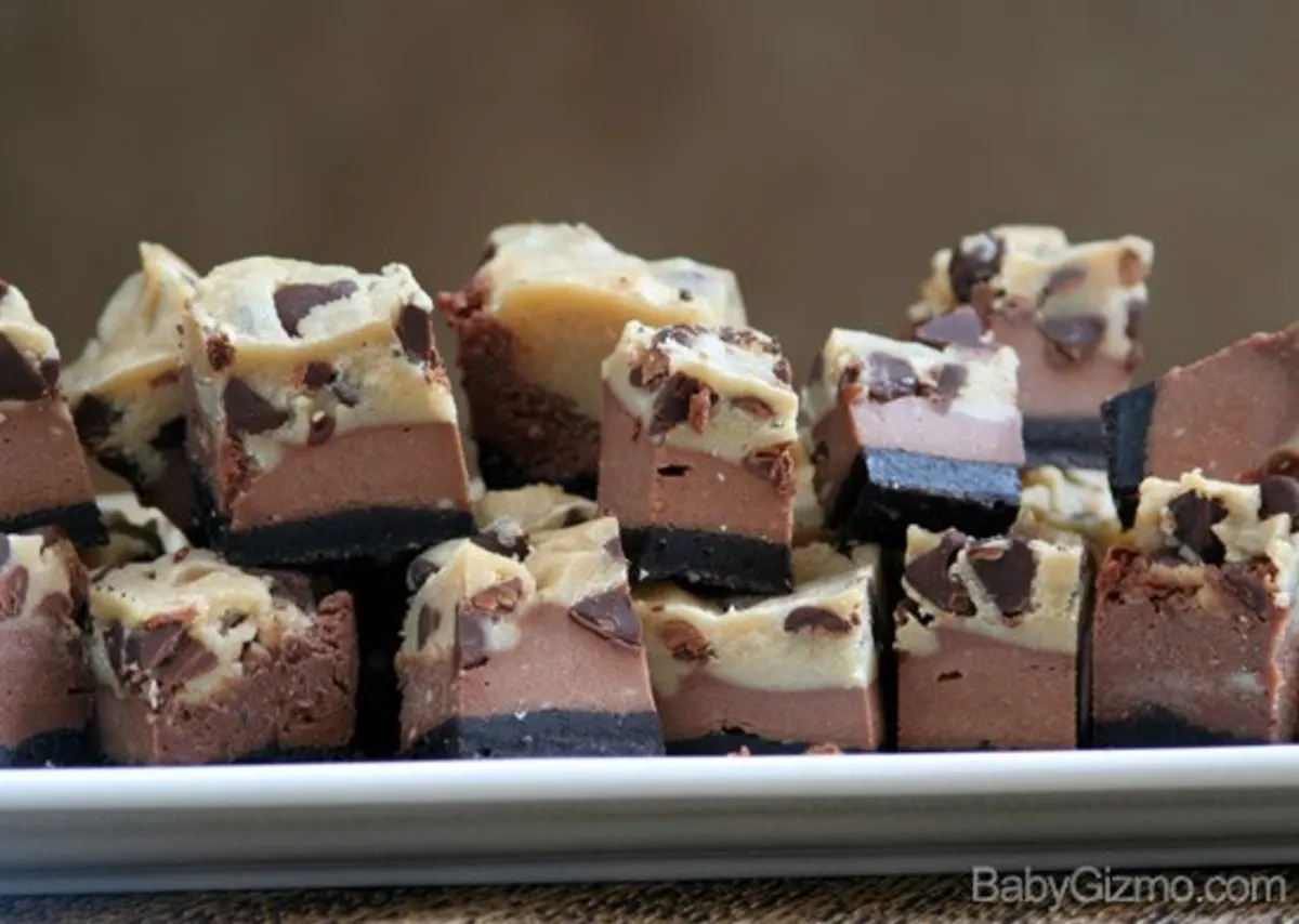 A lot of chocolate cheesecake cookie bits on a white plate 