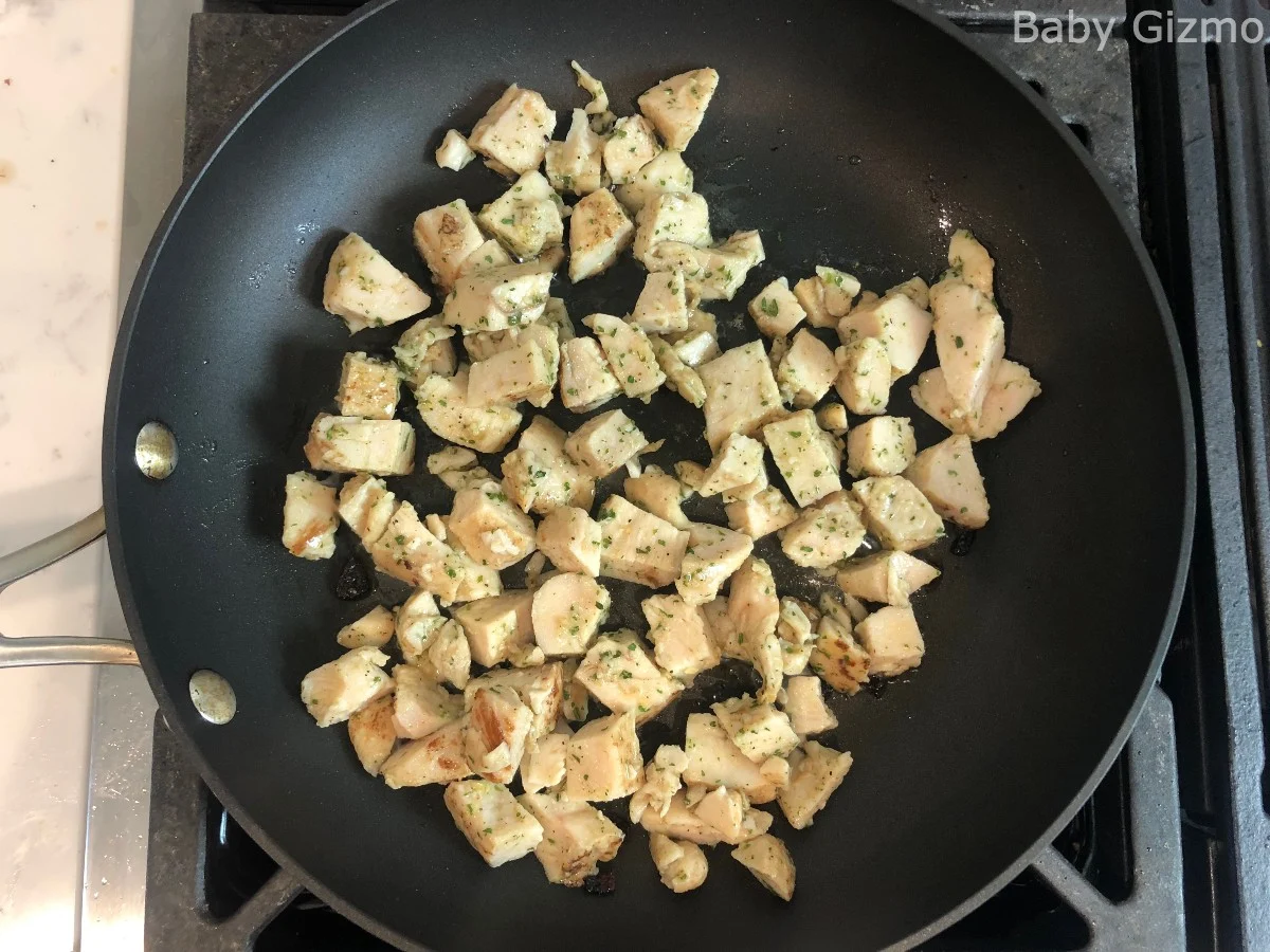 cooked chicken pieces in skillet