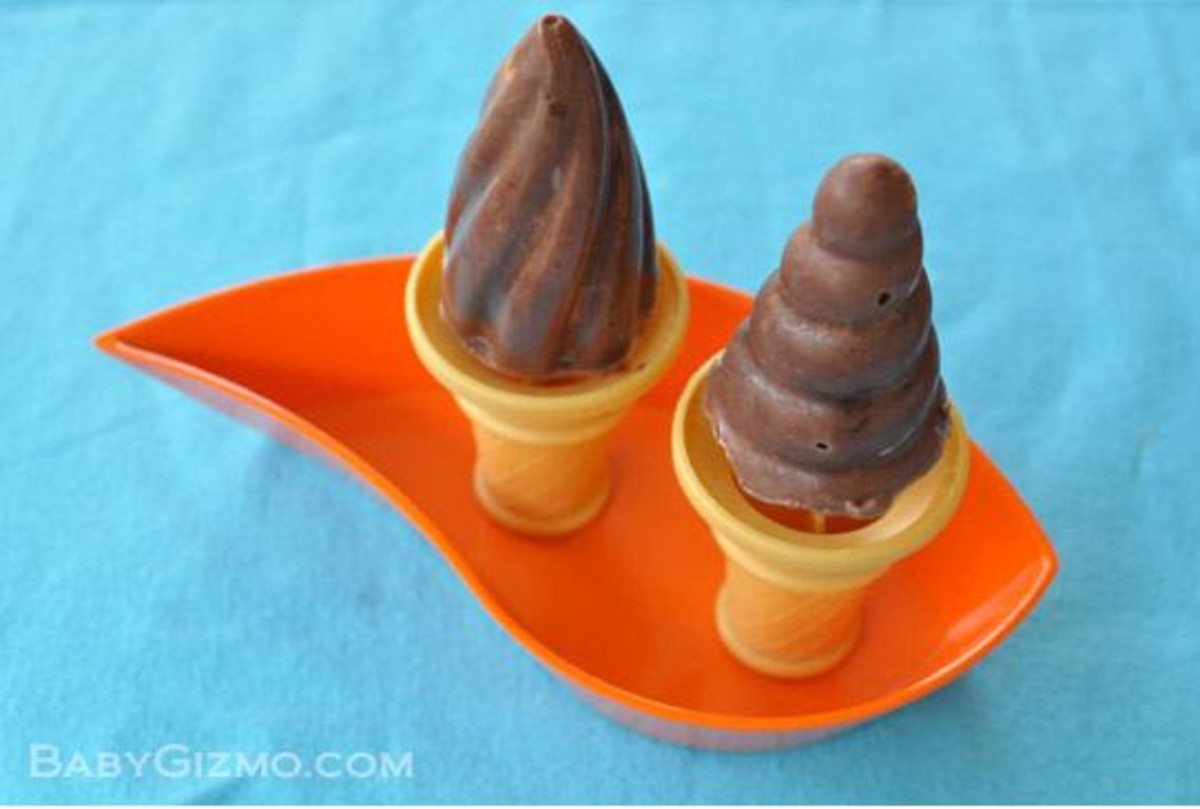 2 double chocolate chip pudding popsicles on an orange plate