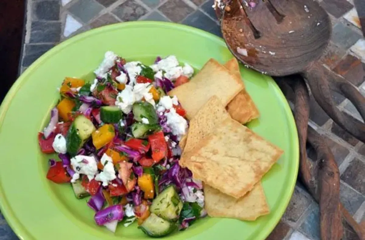Hearty and Delicious Red Cabbage and Feta Chopped Veggie Salad on a green plate